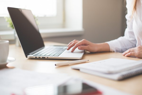 someone typing on a laptop